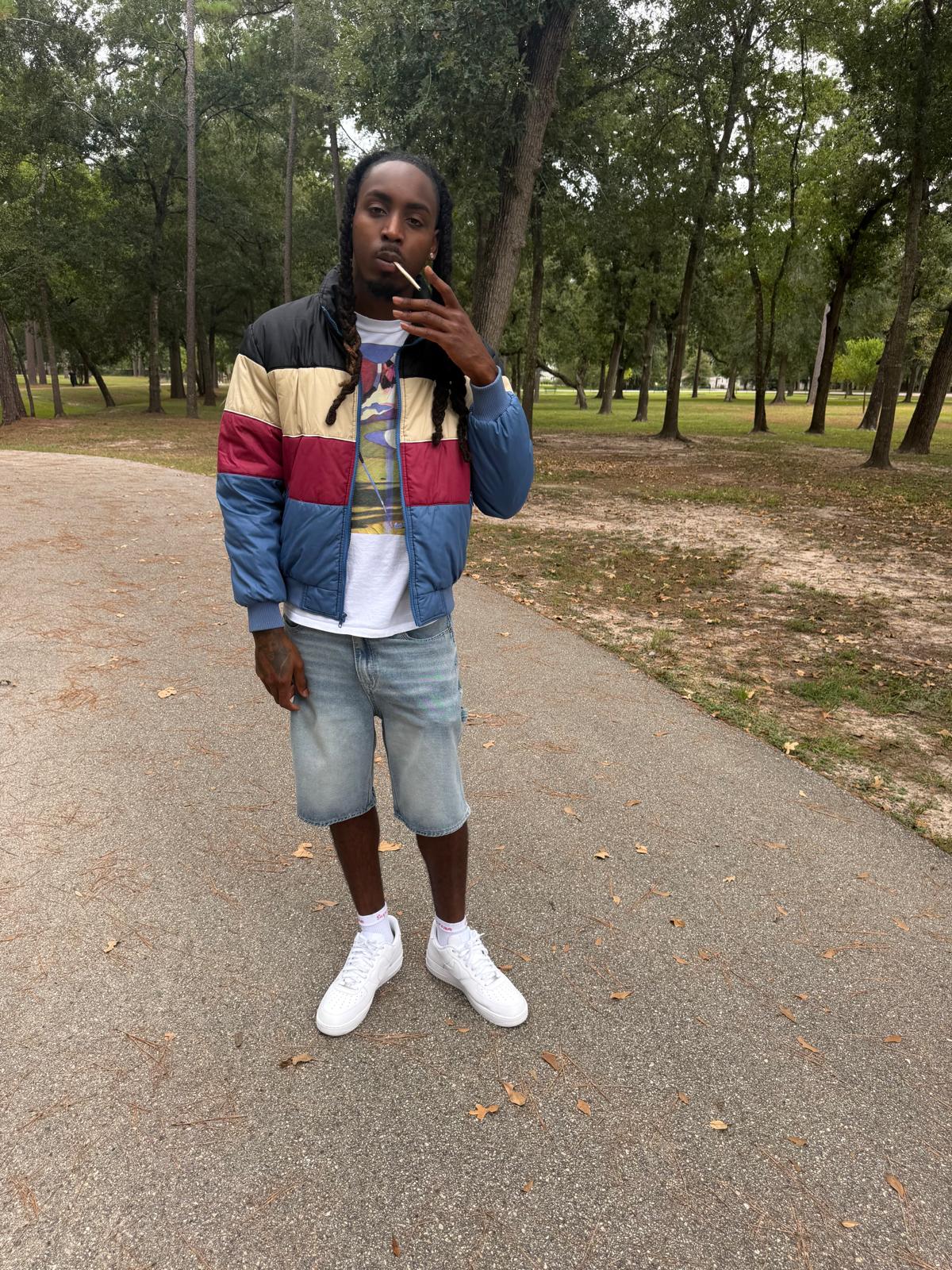 FMR Trill standing outdoors on park path in colorblock jacket